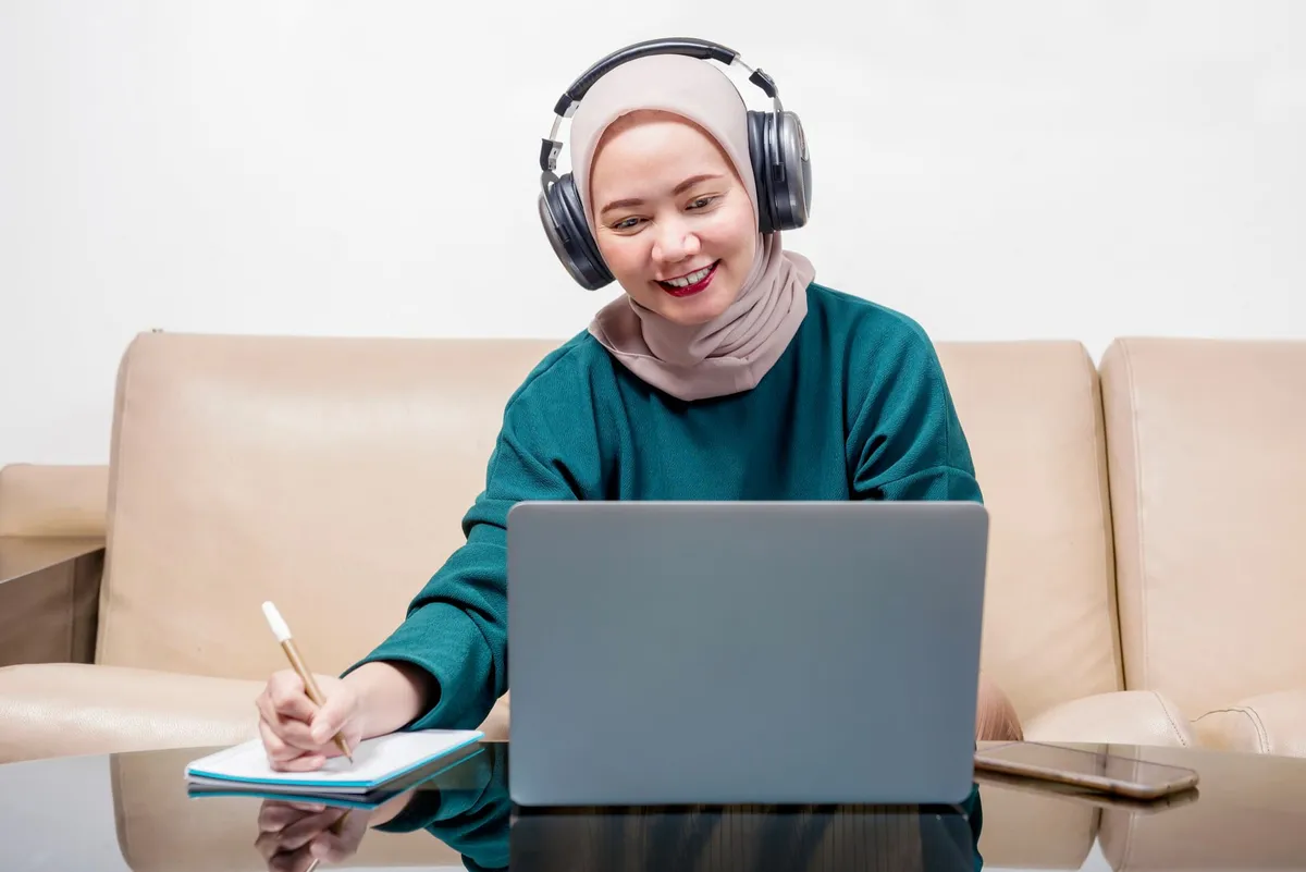 Happy student taking TOEFL prediction test